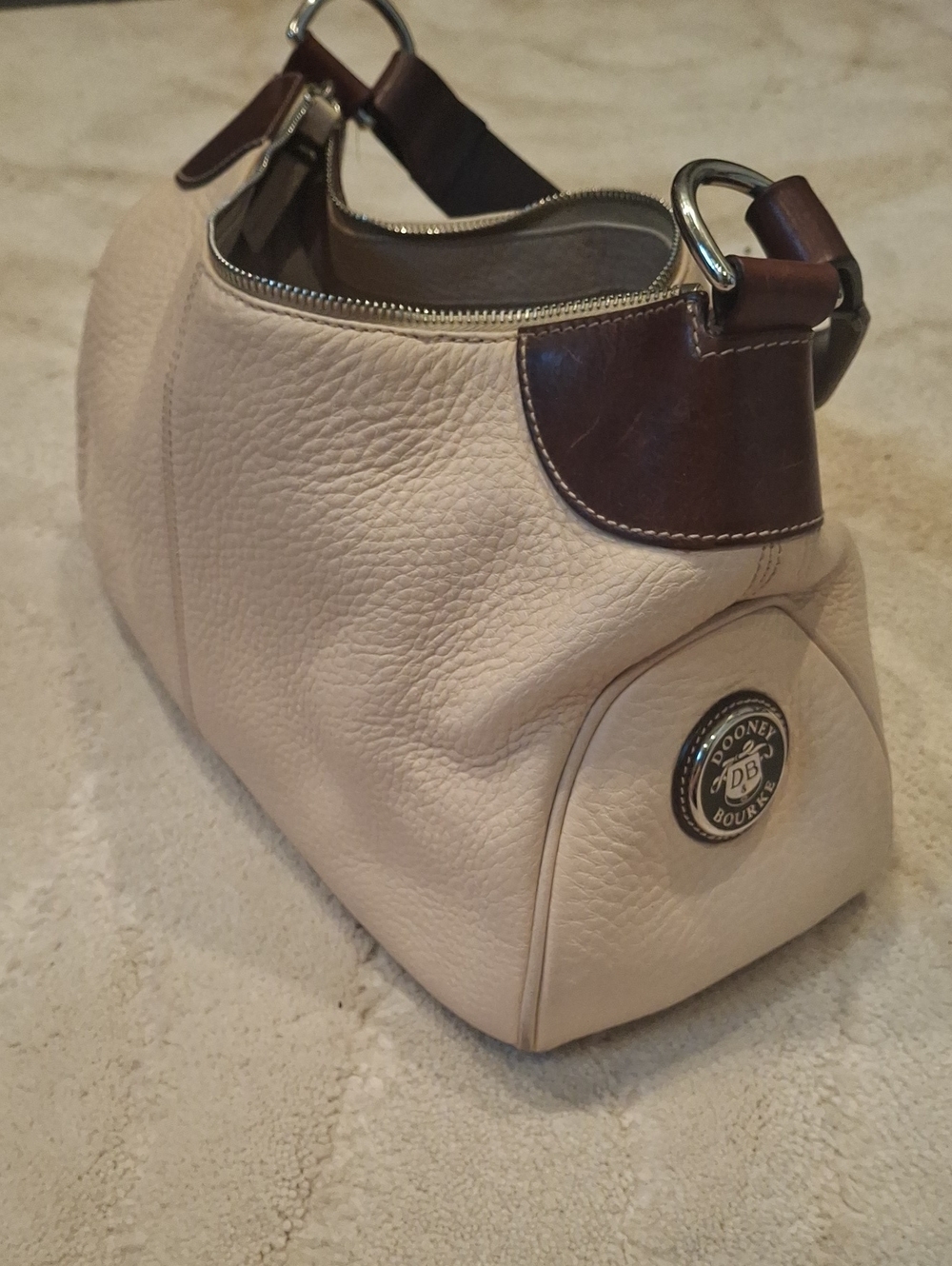 Dooney & Bourke Cream Leather Shoulder Bag with Brown Trim and Silver Hardware